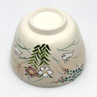 Underside view of the Kyo-yaki Akikusa ni Usagi matcha bowl showing its ceramic foot and hand-painted rabbits, autumn flowers, and grasses