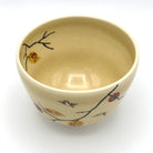 Top interior view of the Kyo-yaki Kaki ni Suzume chawan showing its warm beige glaze and hand-painted persimmon branch decoration around the rim