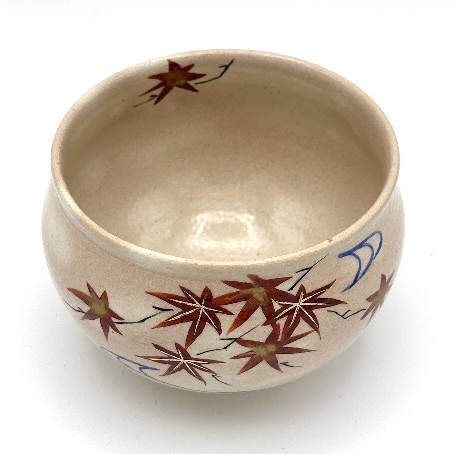 Top interior view of the Kyo-yaki Momiji Ryusui chawan showing its warm beige glaze and hand-painted autumn maple leaves continuing around the rim
