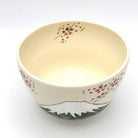 Top interior view of the Kyo-yaki Mt. Fuji matcha bowl showing its warm ivory glaze and hand-painted pink blossom details