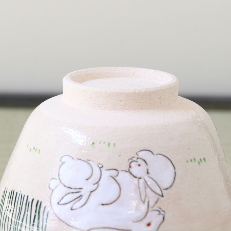 Underside view of the Kyo-yaki Tsukimi matcha bowl showing its ceramic foot and parent and child rabbit motif with subtle green grass decoration