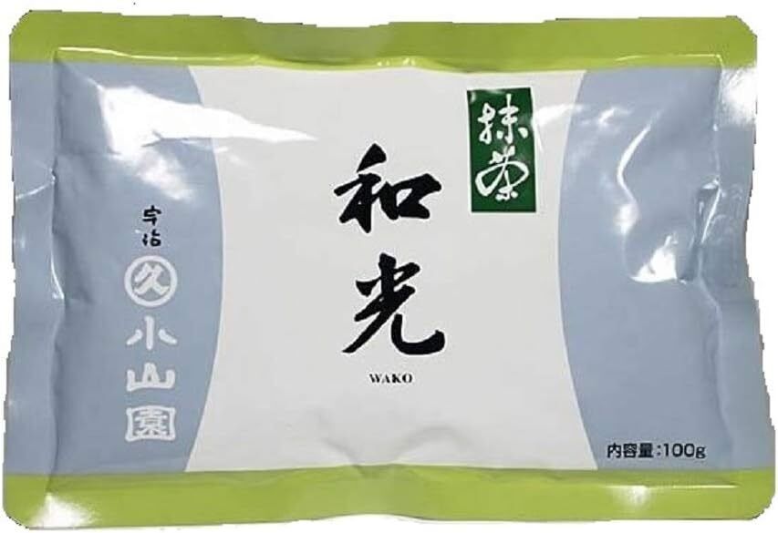 A bag of Wako Matcha by Marukyu Koyamaen with green lid, white body, and label with black Japanese characters.