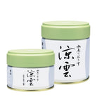 Two matcha containers with green lids and white labels featuring Japanese text on a white background.