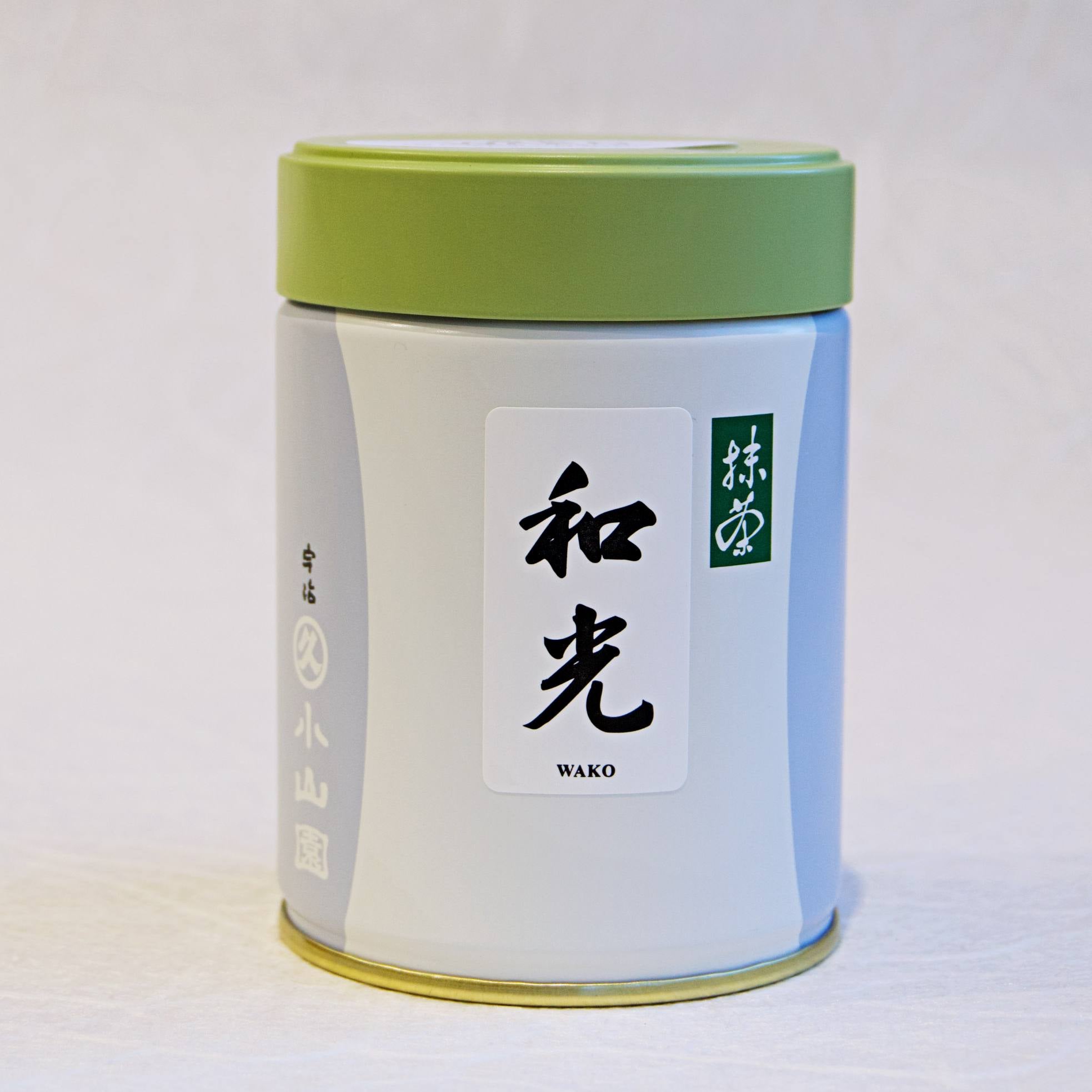 A can of Wako Matcha by Marukyu Koyamaen with green lid, white body, and label with black Japanese characters.