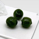 Matcha candies on a white tray with a white background