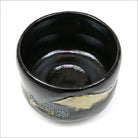 Angled top view of the Black Raku matcha bowl showing its deep glossy interior and Mt. Fuji decoration continuing around the exterior.