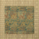 Full view of the moegi-green kobukusa featuring repeating kirin, phoenix, cloud, and gold-foil woven motifs.