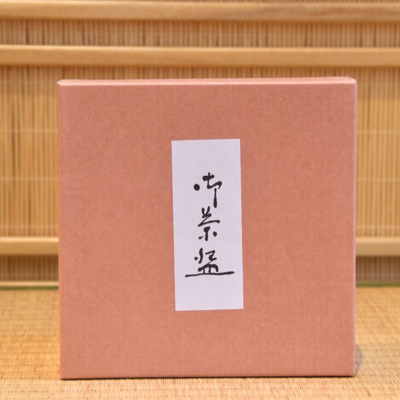 Pink presentation box with a Japanese paper label included with the Moonlit Rabbits matcha bowl.
