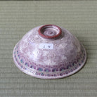 Bottom view of the Morisato Touraku purple floral Hira Chawan showing its decorated exterior and ceramic foot