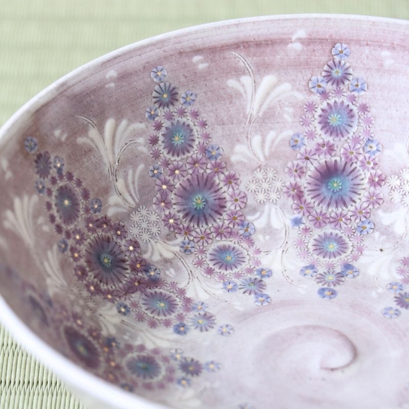 Close-up of the detailed purple and turquoise Kyo-Mishima floral pattern inside the Hira Chawan