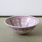 Handcrafted Morisato Touraku Hira Chawan with purple floral decoration and vertical patterned interior