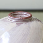 Close-up of the foot and underside of the handcrafted Morisato Touraku Hira Chawan
