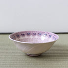 Side view of the Morisato Touraku purple floral Hira Chawan showing its wide shallow summer bowl shape