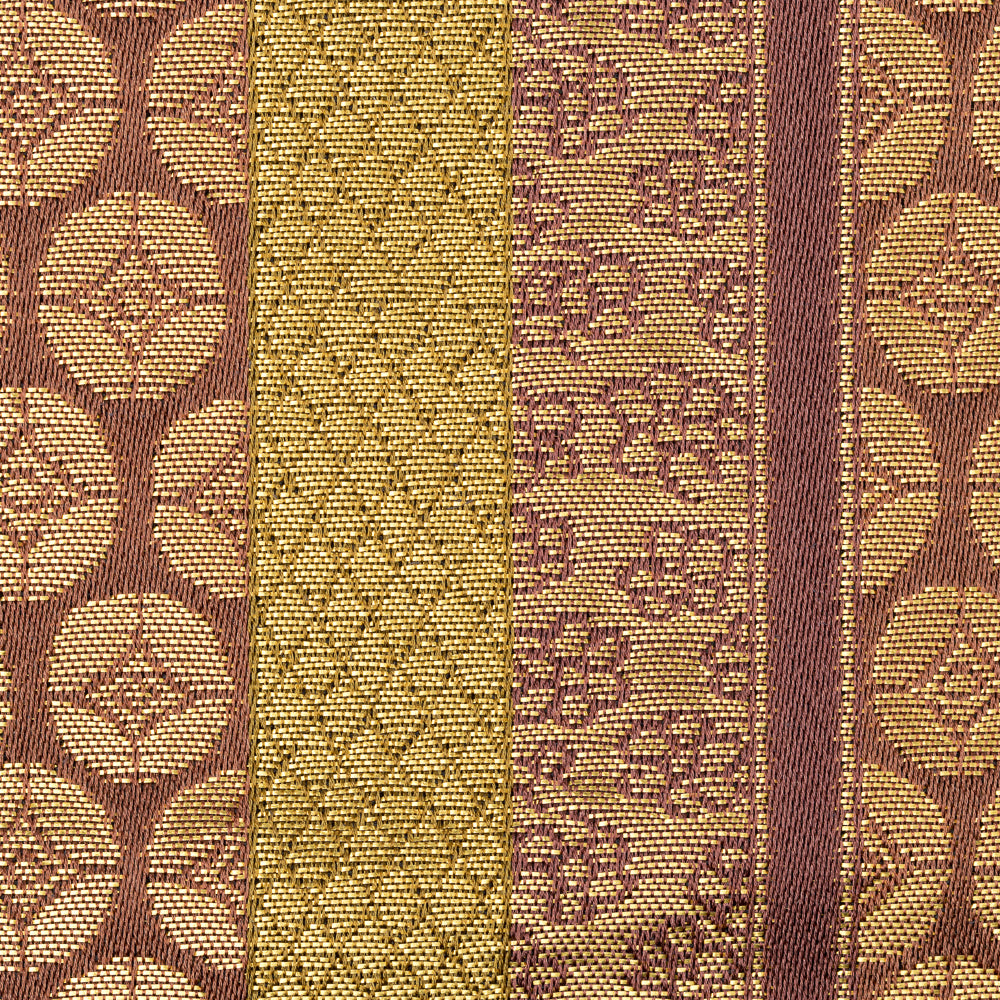 Detailed view of the geometric pattern and kinran gold brocade woven into Murasaki Ji Osaka Shokkin Kinran Kobukusa.