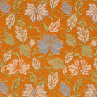 Close-up of white and pale blue chrysanthemums with scrolling vines woven on an orange nashiji-textured silk ground.
