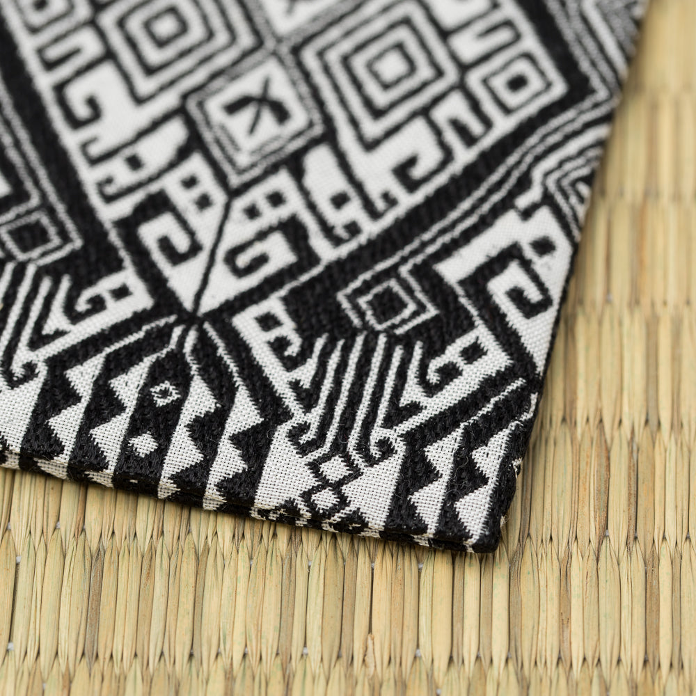 Angled view of Oranda Futsu Momen Kobukusa showing the intricate black and white geometric Nishijin silk weave for the Way of Tea.
