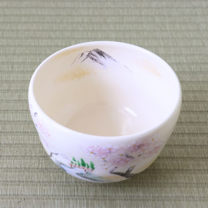 Angled top view of the spring landscape matcha bowl showing its white interior and hand-painted cherry blossom design around the exterior.