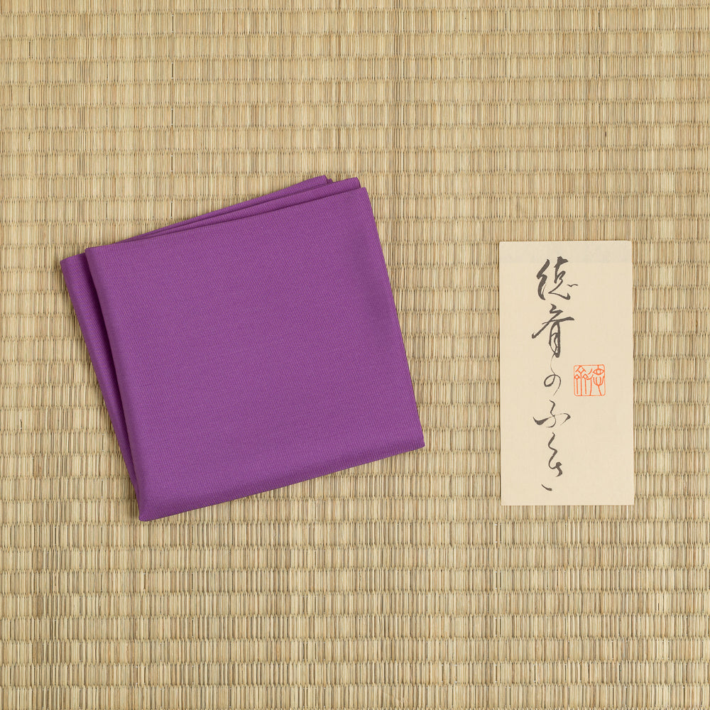 Purple silk fukusa displayed on tatami for Japanese Tea Ceremony