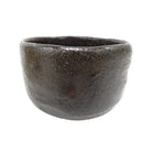 Black ceramic cup on a white background