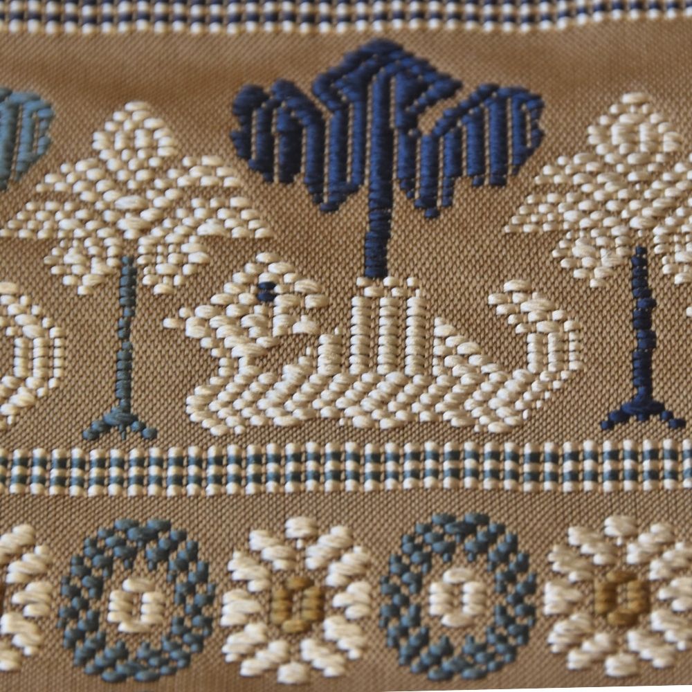 Close-up of the camel motif woven into Kyoto Nishijin silk brocade