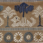 Close-up of the camel motif woven into Kyoto Nishijin silk brocade