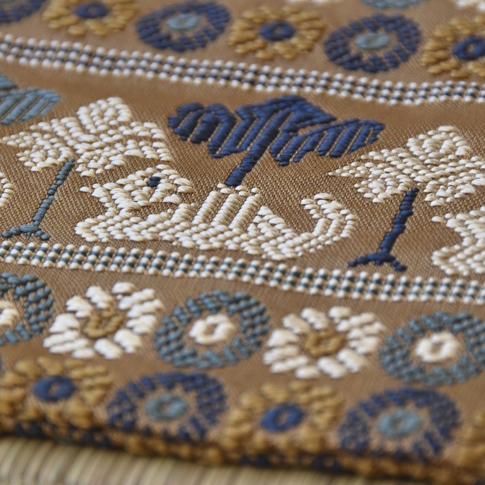 Traditional camel and floral pattern on a Japanese Nishijin silk kobukusa