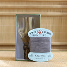 Black bamboo Takayama chasen by Ryosai Kubo displayed with Grey #37 thread and its presentation box