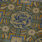 Close-up of dragon motif woven in traditional Nishijin silk brocade from Kyoto