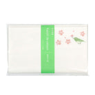 Packaged product with a green label and floral design on a white background