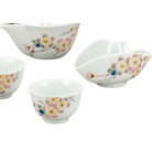 Set of ceramic bowls with floral patterns on a white background