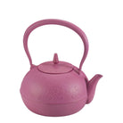 Pink teapot with decorative patterns on a white background
