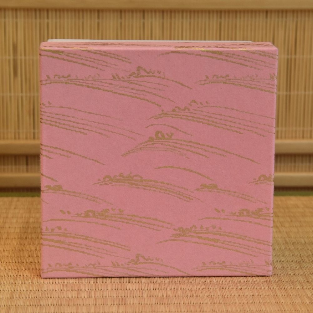 Pink presentation box with a repeating wave pattern included with the Sayaka Isaka Hina Matsuri matcha bowl.