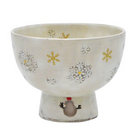 Front view of a Seiwagama Kyo Ware matcha bowl with gold and silver snowflakes on an ivory glaze and a small snowman painted on the tall foot.