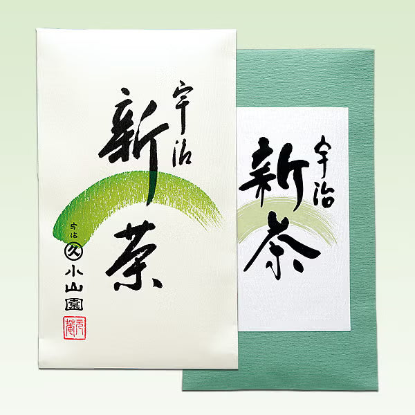 Two cards with black calligraphy on white and green backgrounds