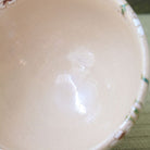 Close-up of the softly textured pale pink interior glaze of the Shisen Asano Nadeshiko chawan