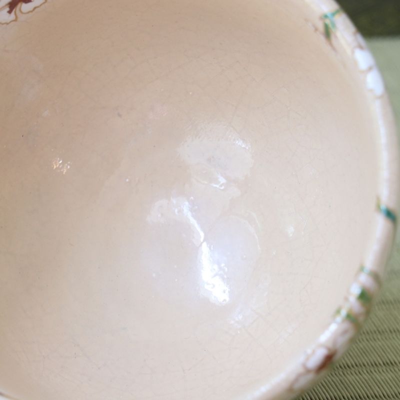 Close-up of the softly textured pale pink interior glaze of the Shisen Asano Nadeshiko chawan