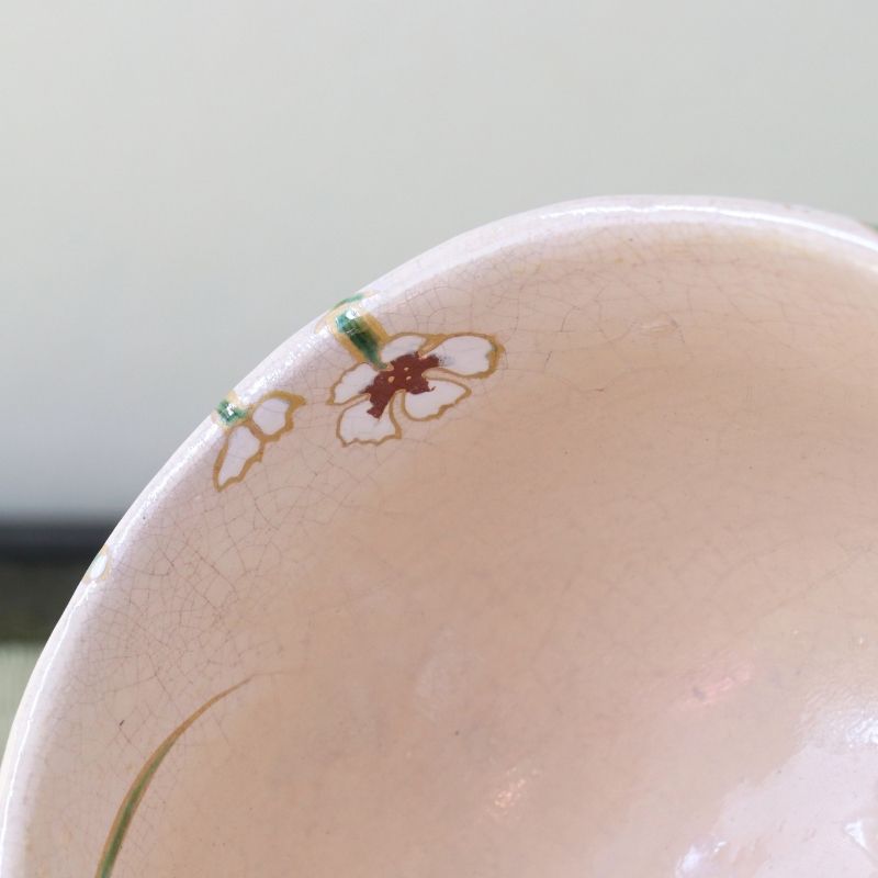 Close-up of the pale pink interior and rim of the Shisen Asano Nadeshiko matcha bowl with a small floral detail visible at the edge