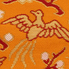 Detailed view of the cherry blossom and golden bird pattern woven into Shoukougire Kobukusa.