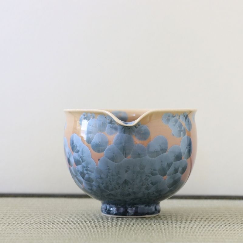 Spout view of the Tōan Ash Blue katakuchi matcha latte bowl highlighting the pouring lip and blue-gray crystalline patterns across the warm-toned glaze