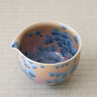 Top interior view of the Tōan Hana-Kesshō Ash Blue katakuchi bowl showing the pouring spout and blue-gray flower crystal glaze continuing across the interior