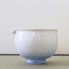 Tōan katakuchi matcha latte pouring bowl featuring a blue and white gradation Hana-Kesshō flower crystal glaze with delicate pale crystalline patterns