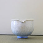Spout view of the Tōan blue and white gradation katakuchi matcha latte bowl highlighting the pouring lip and pale blue flower crystal glaze