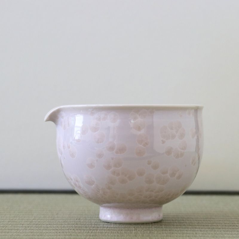 Tōan katakuchi matcha latte pouring bowl featuring a soft cherry blossom pink Hana-Kesshō flower crystal glaze with delicate pale crystalline patterns