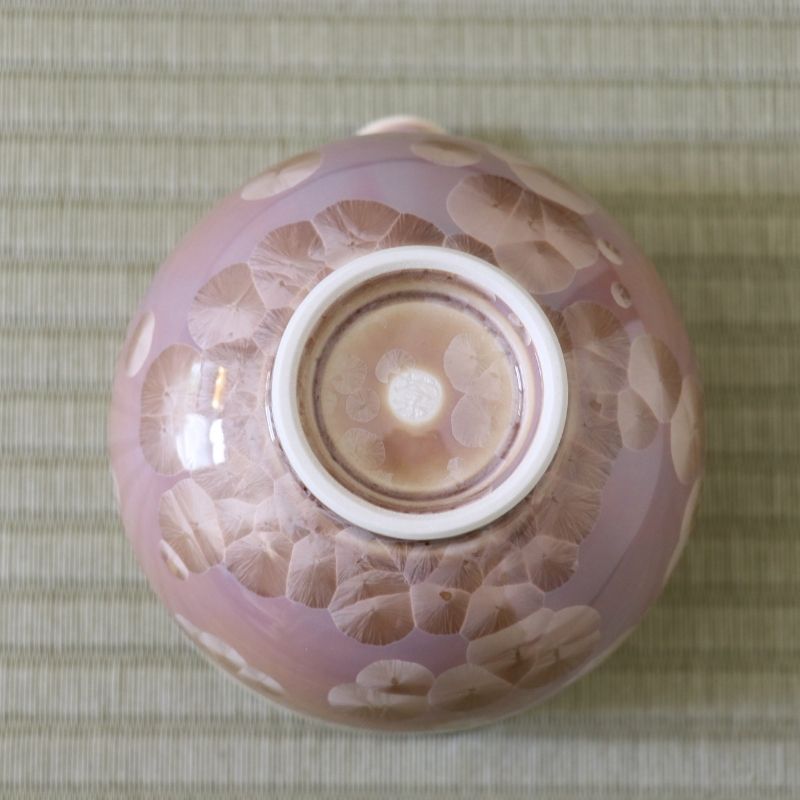 Underside view of the Tōan Hana-Kesshō mocha katakuchi bowl showing its circular ceramic foot and flower crystal glaze across the base