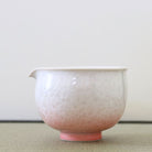 Tōan katakuchi matcha latte pouring bowl featuring a pink and white gradation with delicate Hana-Kesshō flower crystal glaze patterns