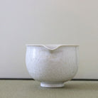 Spout view of the Tōan white katakuchi matcha latte bowl highlighting the pouring lip and dense Hana-Kesshō crystalline glaze