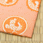 Angled view of Torimaru Kin Futsu Dashibukusa and Kobukusa woven from Kyoto Nishijin silk for the Japanese tea ceremony, Chado, Way of Tea and Otemae.