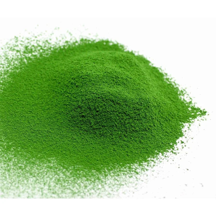 Green powder on a white background