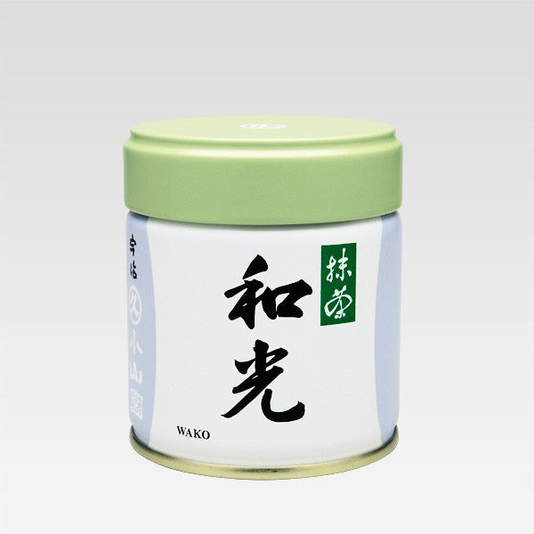 A can of Wako Matcha by Marukyu Koyamaen with green lid, white body, and label with black Japanese characters.