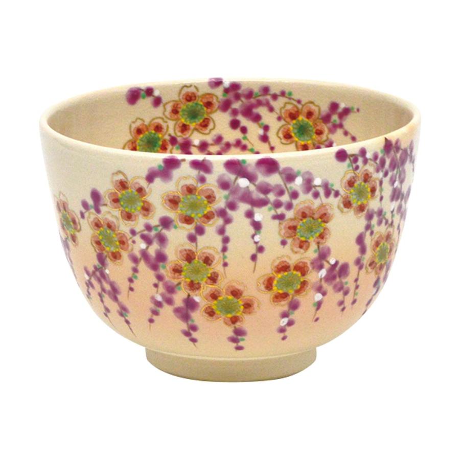 Studio view of the hand-painted Kyo Ware matcha bowl with abundant weeping cherry blossoms, green leaves, and gold floral details.